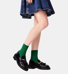 Mocassins en cuir à bords plissés Maje