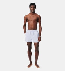 Short de bain mi-long uni Lacoste