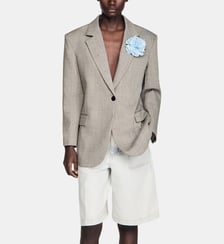 Veste en laine à carreaux et broche Sandro