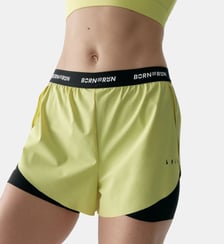Short de sport Voltrun Avec poches détails réfléchissants Born Living Yoga