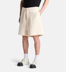 Short ample à bande logotypée en coton et lin JW Anderson