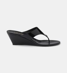 Mules compensées en cuir verni Prada
