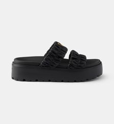 Mules à plateforme en cuir nappa matelassé Prada