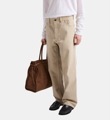 Jean cinq poches en denim vieilli Prada