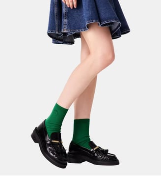 Mocassins en cuir à bords plissés Maje